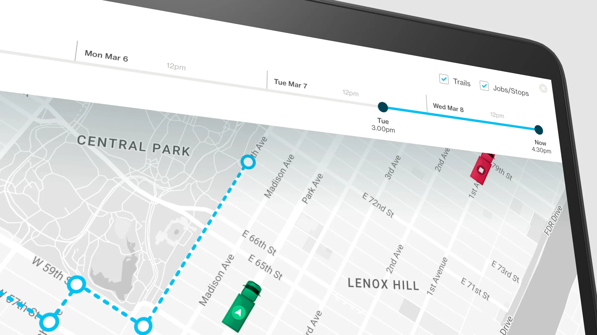 Close-up of the desktop map with a timeline from Monday to now, a dotted route through Midtown Manhattan, and red and green vehicle markers