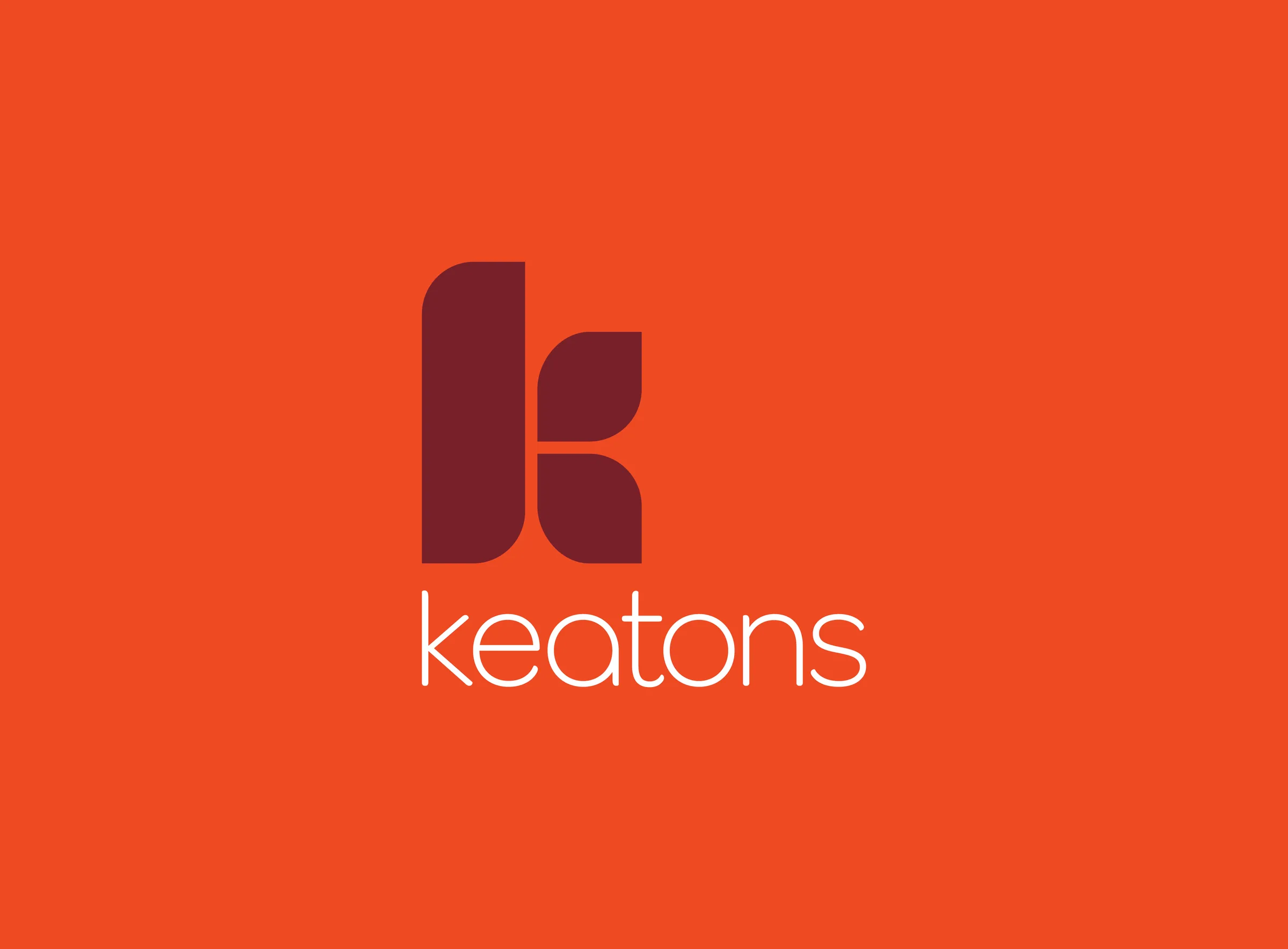 The Keatons logo, a burgundy K built from a tall rounded stem and two leaf shapes, above the white lowercase wordmark keatons on orange
