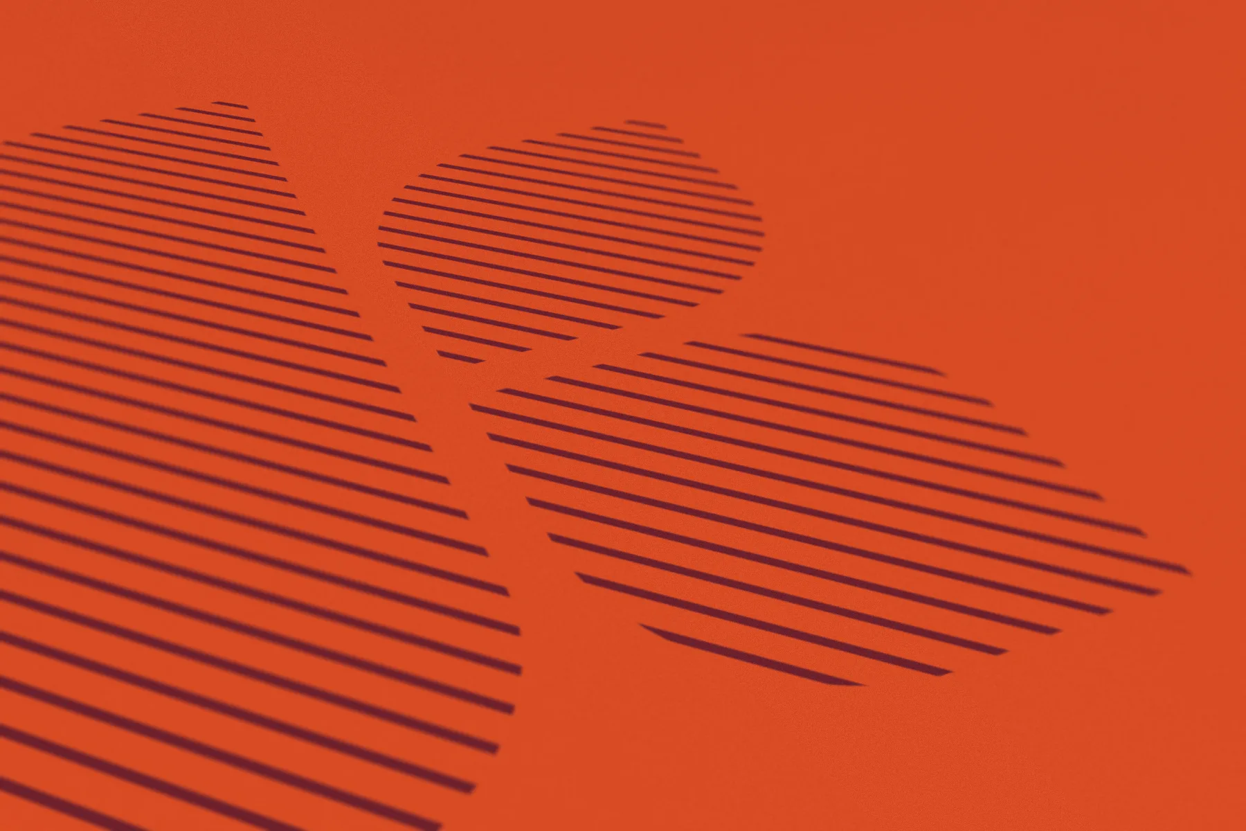 The leaf shapes of the Keatons K filled with burgundy horizontal stripes on an orange surface